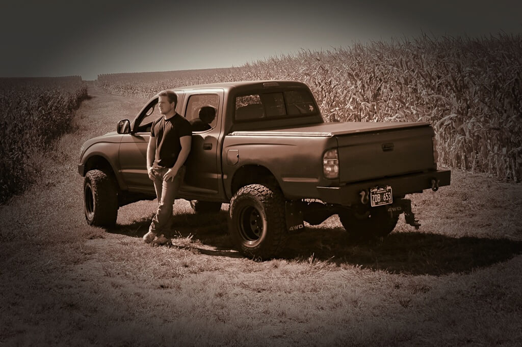 Senior photo, black and white boy and his truck Senior Photo of boy and his truck, vinette