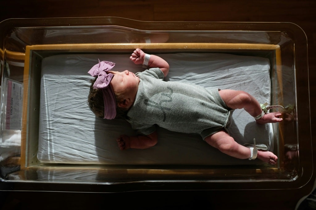 baby girl laying on bed stock pic baby girl laying on bed stock pic