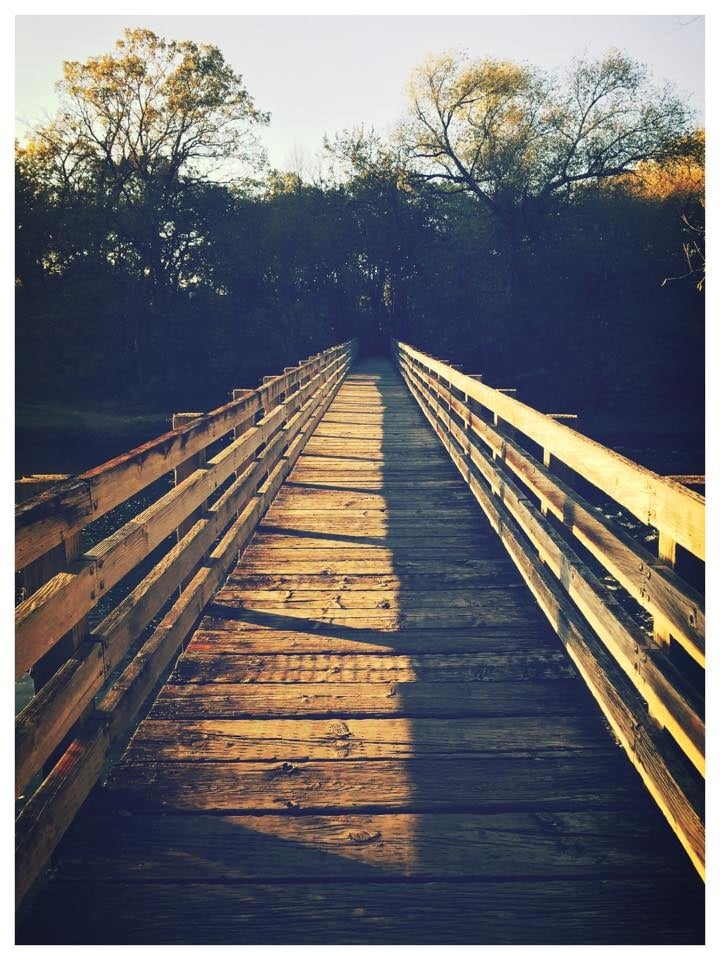 Close up of wooden foot bridge Aged photo of a wooden foot bridge at the start of sunset