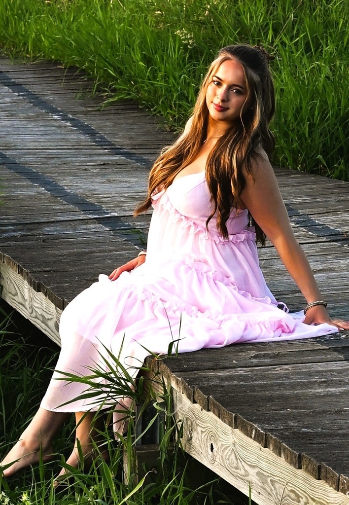 Senior Photo girl with pink dress at St Johsn Senior photo of girl at St Johns Arboretum sitting on floating walking path, pink dress