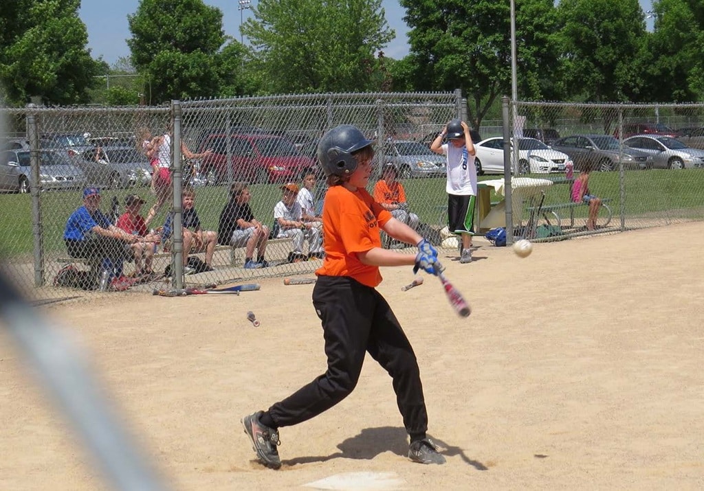 sports photo orange shirt hitting softball sports photo orange shirt hitting softball